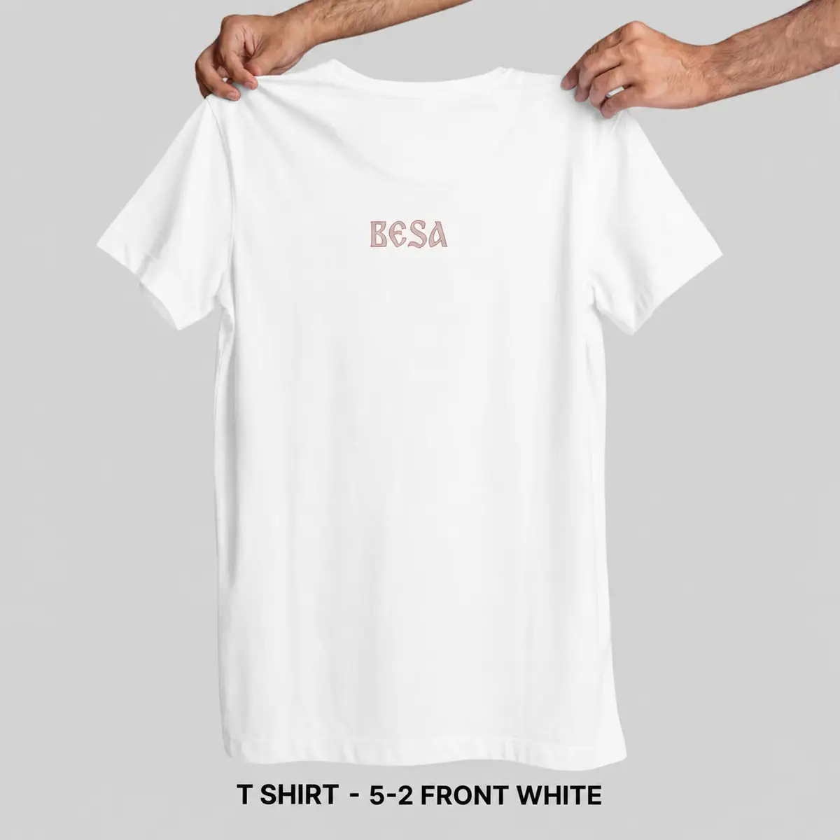 White Besa t-shirt front with small rose chest mark